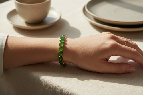 Woman wearing green jadeite tennis bracelet